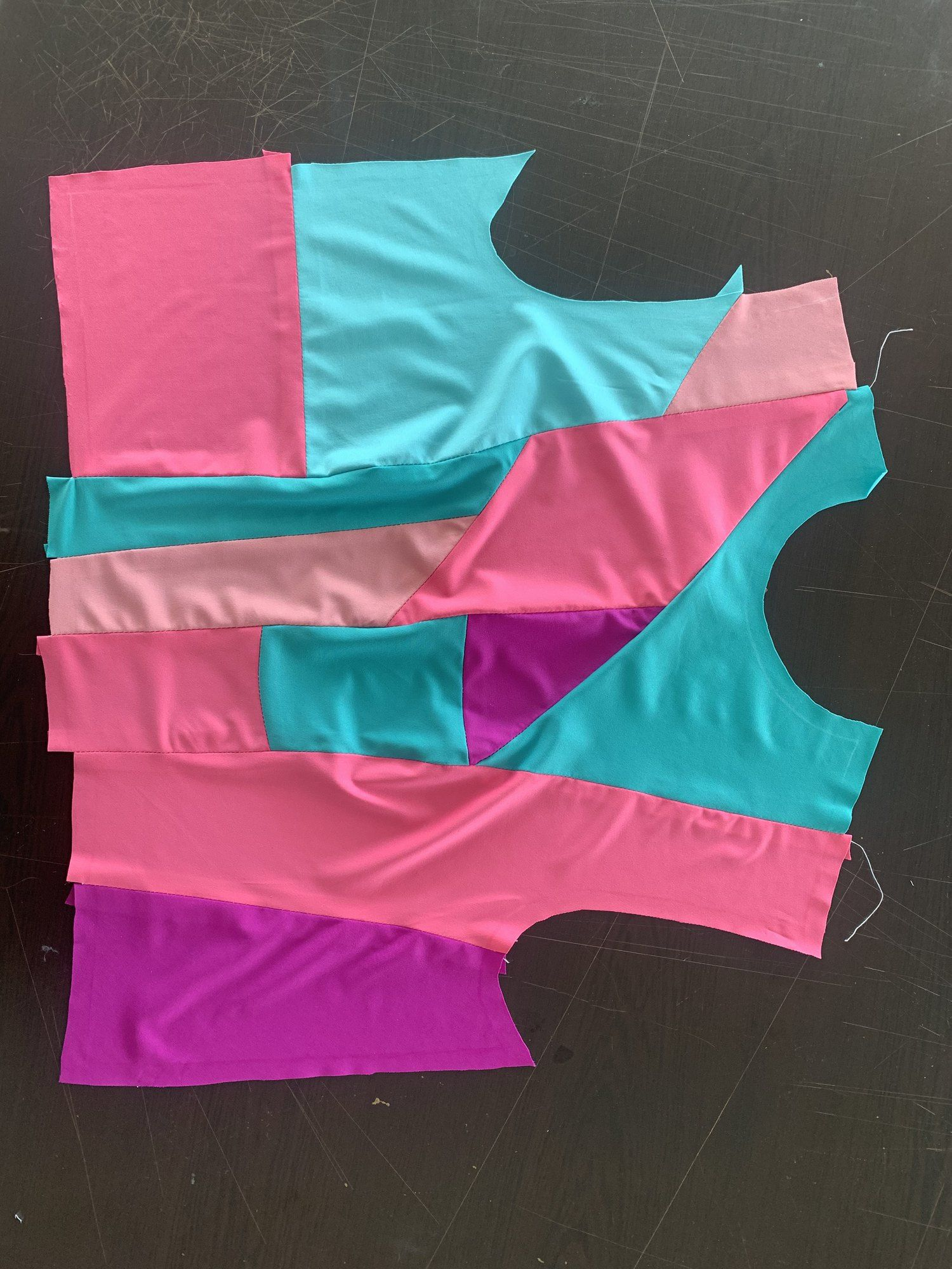 Cut patchwork lycra panels on the studio table