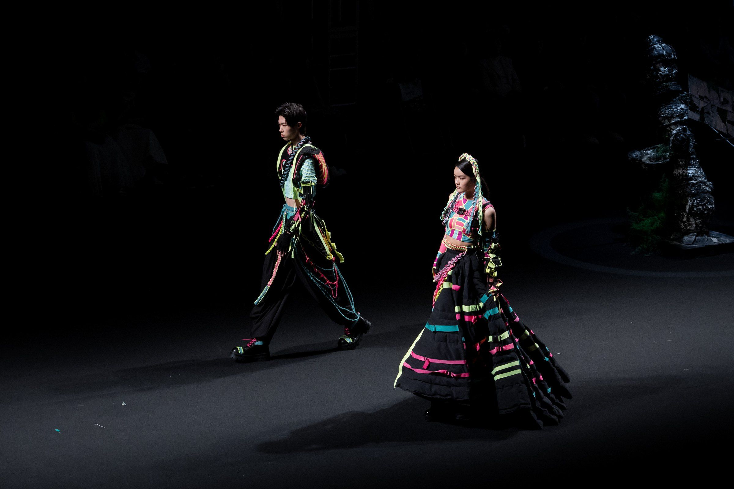 Two models walking together in the dark