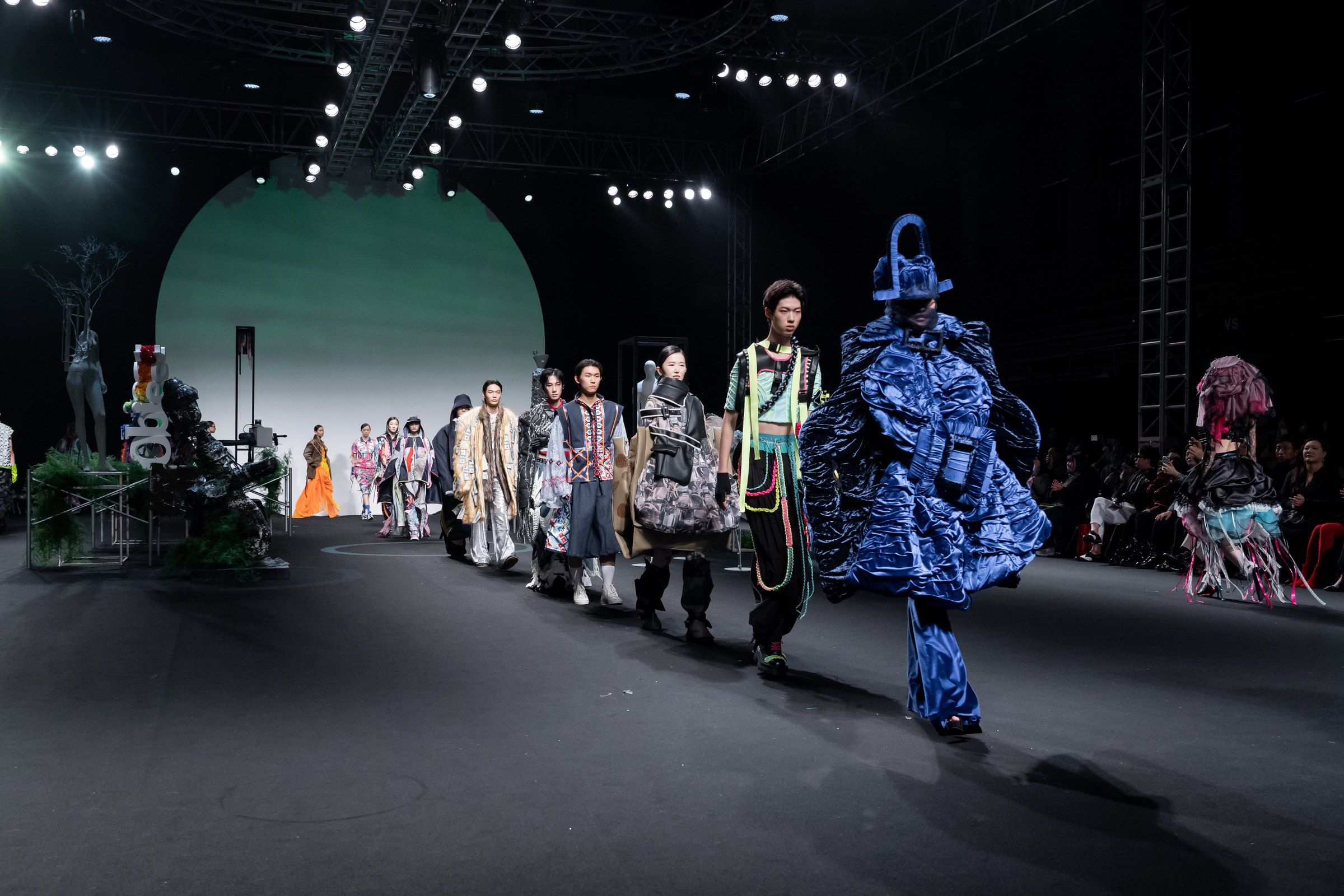 The graduate show finale line-up on the runway