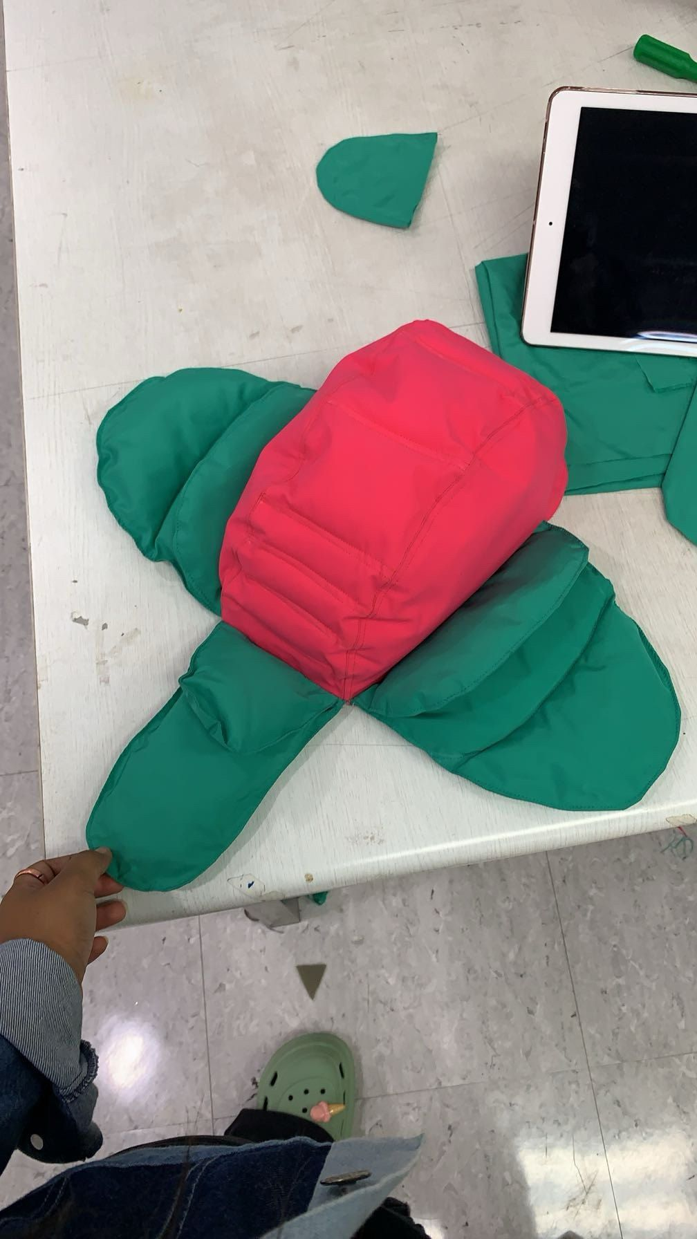 Red and green puffer flower prototype on a table